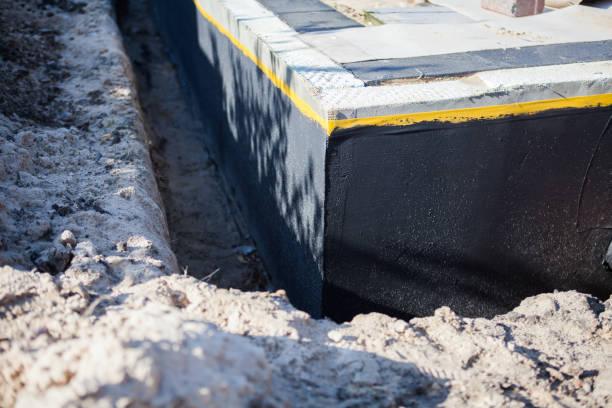 Professional Basement Waterproofing technician working in Creola, AL